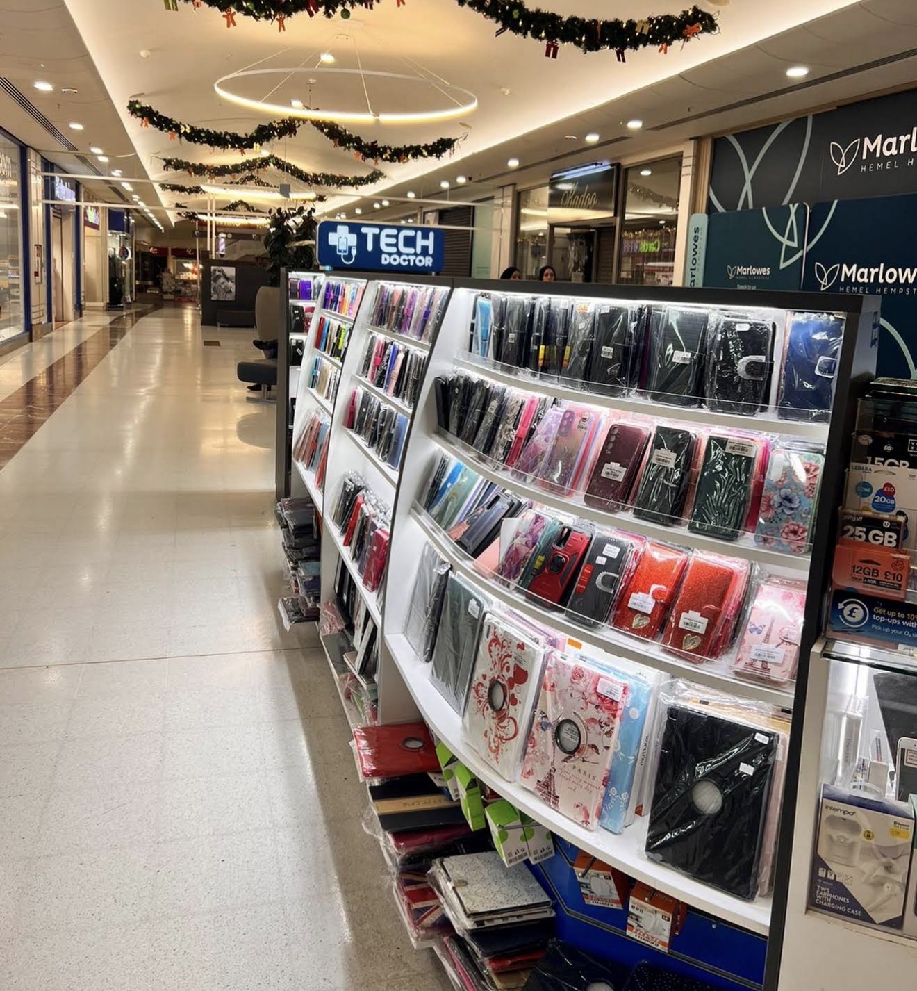 Shelves of laptops and phones at Tech Doctor